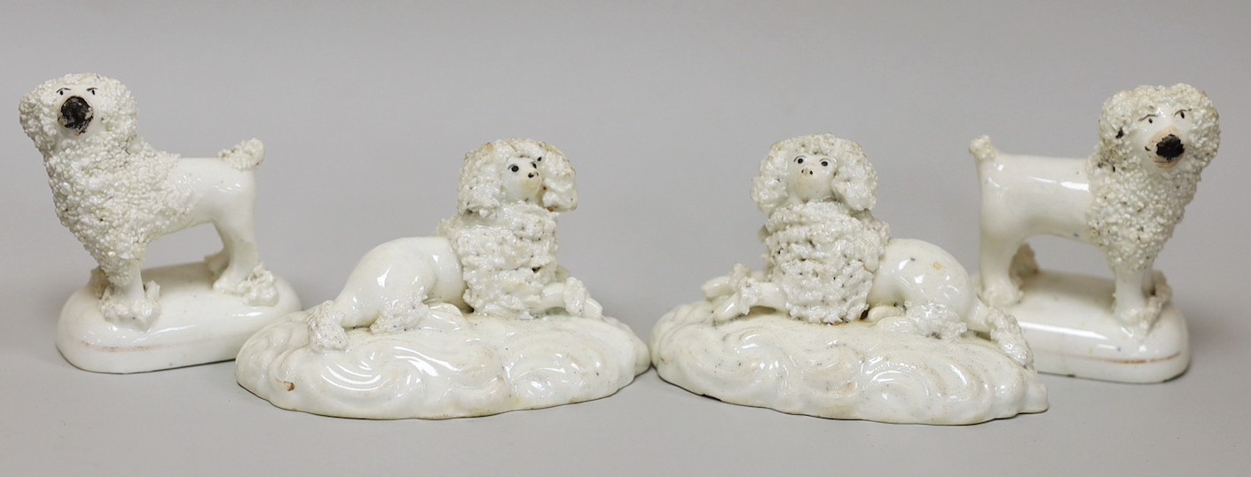 Two pairs of small Staffordshire models of poodles; one pair recumbent and the other standing, c.1830-50, (4), tallest 6cm, Provenance: Dennis G.Rice collection